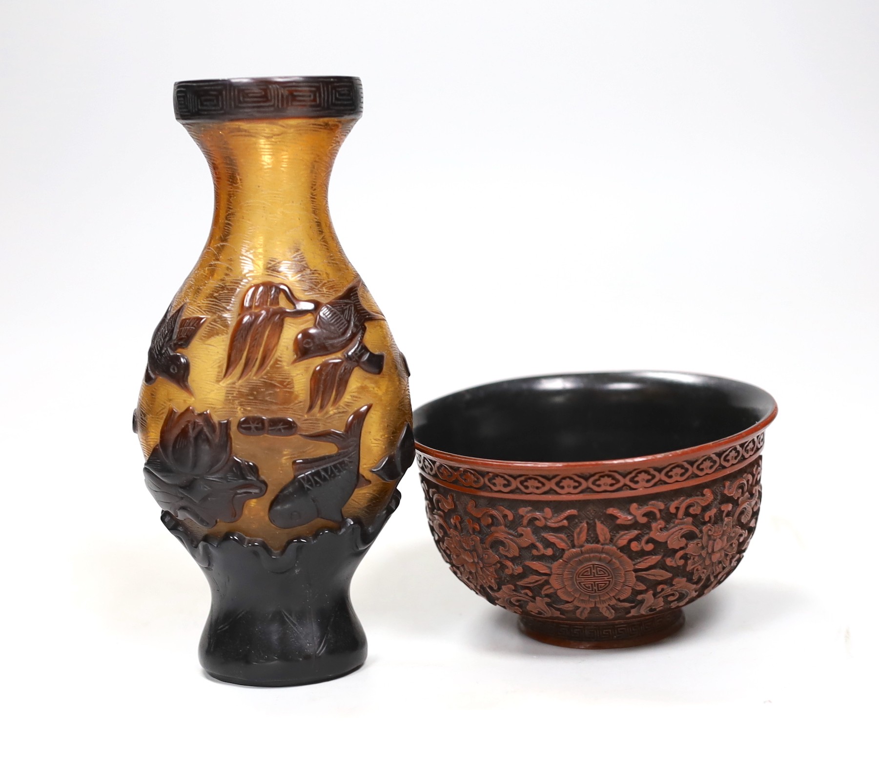 A Chinese red lacquer bowl and a Chinese overlaid glass vase, 17cm